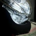 Fore Distillery Globe Decanter nested in a frame